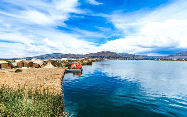 Lake Titicaca is the world’s highest navigable lake and is considered the birthplace of the Incas. Visitors can explore the unique Uros Floating Islands, made entirely of reeds, and Taquile Island, known for its traditional weaving. The deep blue waters against the stark Altiplano landscape create a mystical atmosphere, offering a deep dive into ancient Andean traditions and culture.