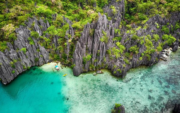 El Nido is a gateway to the spectacular Bacuit Archipelago, known for its towering limestone cliffs, hidden lagoons, and pristine white-sand beaches. Island hopping tours allow visitors to kayak through emerald waters and snorkel in vibrant coral gardens. It is consistently ranked as one of the most beautiful island destinations in the world, offering a raw and majestic natural beauty.