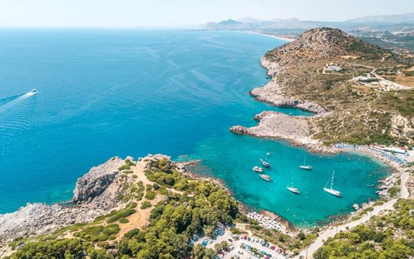 Named after the famous actor who filmed "The Guns of Navarone" here, this bay is known for its emerald-green waters and dramatic rocky surroundings. It is one of the most beautiful spots on Rhodes for snorkeling and swimming. The secluded atmosphere and the natural beauty of the cove attract visitors looking for a tranquil and scenic day by the Aegean Sea.