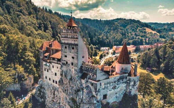 Often associated with the legend of Dracula, Bran Castle is a stunning medieval fortress perched on a cliff in Transylvania. Its narrow winding staircases and timbered rooms are filled with history and mystery. Beyond the myth, it was a royal residence and offers breathtaking views of the surrounding Carpathian Mountains, making it Romania's most iconic and visited landmark.