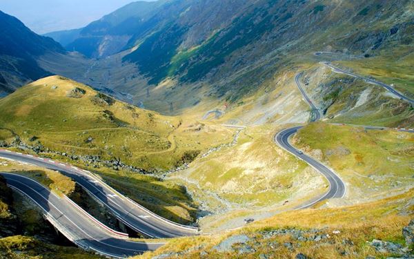 The Transfăgărășan is a dramatic mountain road that winds through the highest peaks of the Southern Carpathians. Famous for its steep hairpin turns and spectacular views, it has been called one of the best driving roads in the world. Visitors can explore Bâlea Lake and the Vidraru Dam along the route, experiencing the raw and majestic power of Romania’s alpine landscape.