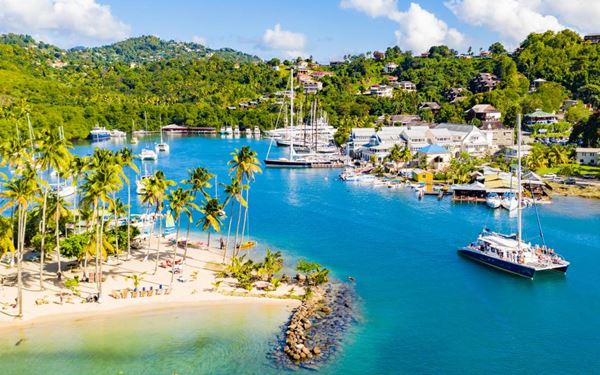 Marigot Bay is often described as the most beautiful bay in the Caribbean. Surrounded by steep, forested hills, this deep-water harbor has served as a historic refuge for fleets and a filming location for several movies. Today, it is a luxurious destination for yachts and travelers seeking a serene and picturesque landscape filled with high-end dining and resorts.