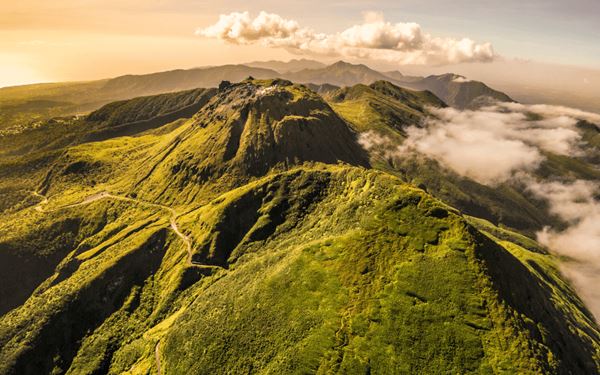 La Soufrière is an active stratovolcano that dominates the northern landscape of Saint Vincent. Adventurous travelers can hike to the rim of the massive crater for an awe-inspiring view of the interior and the surrounding coastline. The trail leads through diverse vegetation, from bamboo forests to cloud forests, offering a challenging yet rewarding experience in nature.