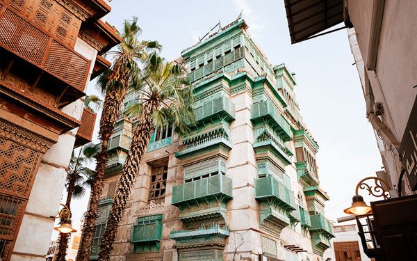 Al Balad is the historic heart of Jeddah and a UNESCO World Heritage site, known for its unique houses built from coral stone and decorated with intricate wooden balconies (rawashin). Exploring its narrow alleys reveals traditional markets and historic mosques that have welcomed pilgrims for centuries. It is a vibrant testament to the city's role as a major Red Sea trading port.