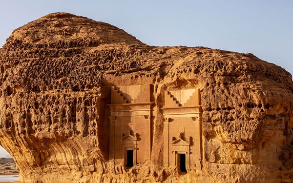 Hegra is Saudi Arabia's first UNESCO World Heritage site, featuring over 100 monumental tombs carved into sandstone outcrops by the Nabataeans. Often called the "sister city" of Petra, its well-preserved facades and ancient inscriptions offer a window into a lost civilization. The surrounding desert landscape of Al-Ula is a majestic open-air museum of history and geology.