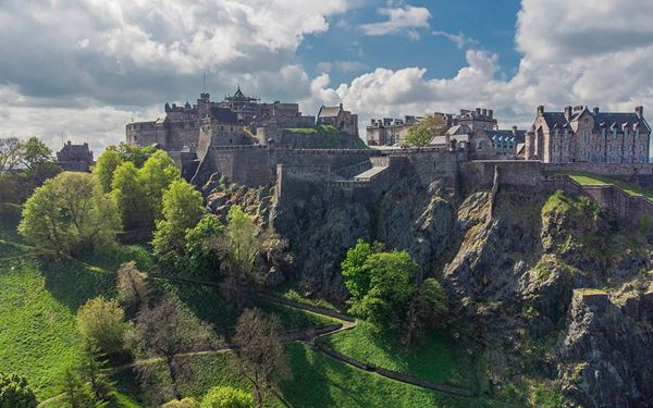 Edinburgh Castle is a historic fortress that dominates the city's skyline from its position on Castle Rock. It houses the Honors of Scotland (the Crown Jewels) and the Stone of Destiny. A walk through its ancient gates reveals centuries of royal and military history, offering spectacular views over the Royal Mile and the city’s stunning blend of medieval and Georgian architecture.