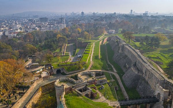 Belgrade Fortress is the historic core of the Serbian capital, located at the confluence of the Danube and Sava rivers. It features ancient walls, gates, and the Victor Monument. The surrounding Kalemegdan Park is a popular spot for locals to relax and enjoy the sunset. The fortress has witnessed over 100 battles, representing the city's strategic importance and its resilient, layered history.