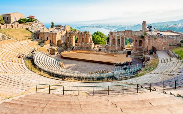 Taormina is a picturesque hilltop town famous for its remarkably preserved Greco-Roman theatre. The theatre is still used for performances and offers a legendary view that frames Mount Etna and the turquoise Ionian Sea through its ancient columns. With its elegant boutiques, narrow medieval streets, and the beautiful Isola Bella beach below, Taormina is the crown jewel of Sicilian coastal glamour and history.