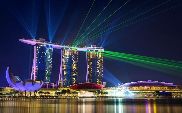 Marina Bay Sands is an architectural marvel and a world-famous resort featuring the iconic SkyPark and infinity pool that stretches across its three towers. It offers the most spectacular views of the Singapore skyline. Visitors can enjoy luxury shopping, high-end dining, and the nearby ArtScience Museum, making it a central hub for entertainment and a must-see landmark in the city-state.