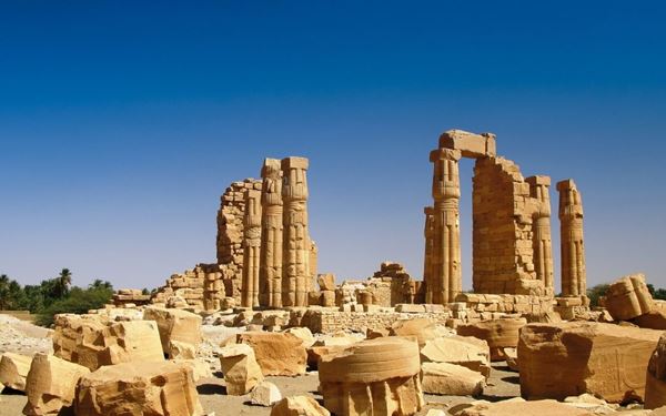 The Temple of Soleb is an ancient Egyptian sandstone temple built by Amenhotep III, featuring majestic columns and detailed reliefs. Located on the west bank of the Nile, it is considered the most beautiful Egyptian temple in Sudan. Walking through its grand ruins at sunset provides a serene and historical experience, highlighting the deep cultural and architectural connections between ancient Egypt and the Nubian region.
