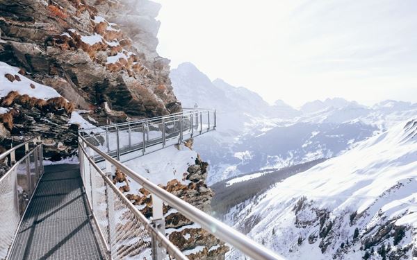 Known as the "Top of Europe," Jungfraujoch is home to the highest railway station in Europe. Located at 3,454 meters, it offers breathtaking views of the Aletsch Glacier and the surrounding high peaks of the Eiger and Mönch. Visitors can explore the Ice Palace and Sphinx Observatory, experiencing a world of eternal snow and ice in the heart of the Bernese Oberland.