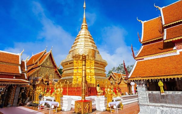 Wat Phra That Doi Suthep is a sacred golden temple perched on a mountain overlooking the city of Chiang Mai. Visitors can climb the 306-step Naga staircase to reach the shimmering pagoda. The temple offers a peaceful atmosphere and panoramic views of the northern highlands. It is a site of deep spiritual significance and a masterpiece of Lanna architecture, representing the cultural soul of Northern Thailand.