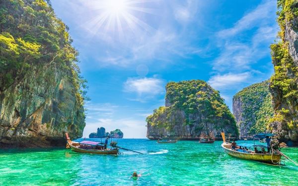 The Phi Phi Islands are world-renowned for their spectacular limestone cliffs, turquoise lagoons, and white-sand beaches like Maya Bay. It is a premier destination for snorkeling, diving, and boat tours. The dramatic scenery of jagged peaks rising from the Andaman Sea creates a tropical paradise that has become an iconic symbol of Thailand’s natural beauty and a must-visit for travelers seeking coastal adventure.