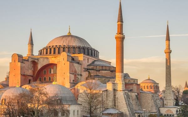 Hagia Sophia is an architectural wonder that has served as a cathedral, a mosque, and a museum. Its massive dome and intricate mosaics represent the transition from the Byzantine to the Ottoman Empire. Located in the heart of Istanbul, it stands as a global symbol of cultural and religious history, attracting millions with its grand scale and timeless beauty.