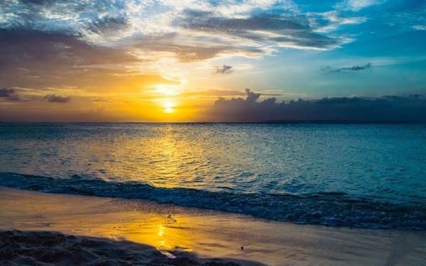 Grace Bay is consistently ranked as one of the best beaches in the world, featuring twelve miles of powdery white sand and incredibly clear turquoise water. Protected by a massive barrier reef, the water is calm and perfect for swimming and snorkeling. It is the crown jewel of Providenciales, offering a luxurious yet tranquil tropical environment that showcases the quintessential beauty of the Caribbean.