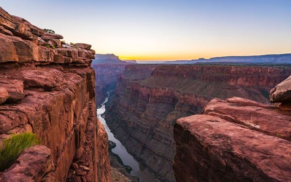 The Grand Canyon in Arizona is one of the world's most spectacular natural wonders, carved by the Colorado River over millions of years. Its vast scale and vibrant layers of red rock offer breathtaking vistas from the South and North Rims. Whether hiking into the canyon or viewing it from above, it provides a profound and humbling perspective on the geological history of the Earth.