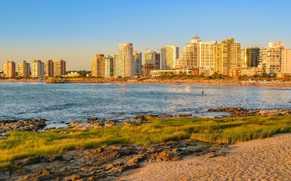 Punta del Este is South America’s most glamorous seaside resort, known for its high-end boutiques, luxury yachts, and the iconic "La Mano" sculpture rising from the sand. It features two coasts: the calm "Playa Mansa" and the surfing-friendly "Playa Brava." It is a hub of vibrant nightlife and art, blending modern urban style with spectacular Atlantic beaches, making it the premier destination for summer relaxation and social life.