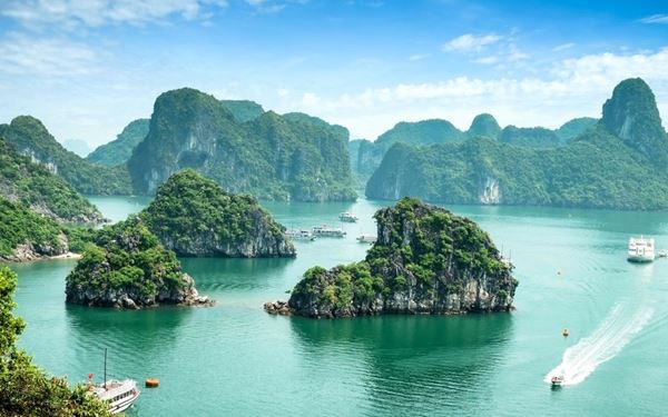 Ha Long Bay is a UNESCO World Heritage site famous for its thousands of towering limestone karsts and isles rising from emerald waters. Cruising through the bay allows visitors to explore hidden caves, floating villages, and secluded beaches. It is a mystical and breathtaking natural wonder that stands as the most iconic destination in Vietnam, offering a truly unforgettable landscape.