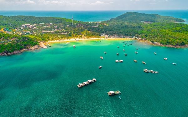 Phu Quoc, known as the "Pearl Island," is famous for its powdery white-sand beaches like Sao Beach and crystal-clear turquoise waters. It is a haven for water sports, luxury retreats, and exploring the Phu Quoc National Park. The island is also renowned for its traditional fish sauce factories and vibrant night markets, offering a perfect tropical paradise experience with a unique blend of high-end tourism and local island life.