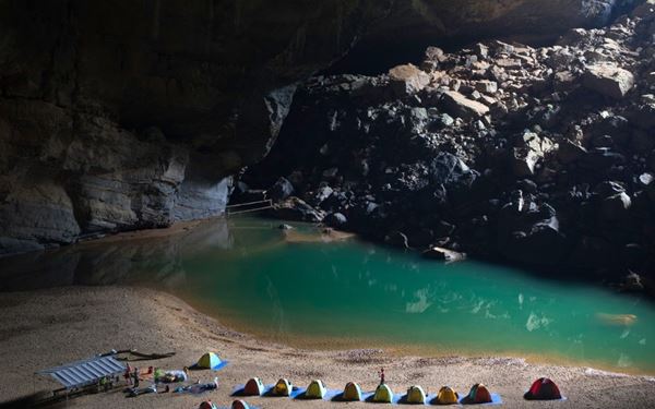 Son Doong is the largest cave in the world, located in Phong Nha-Ke Bang National Park. It is so massive that it has its own localized weather system, clouds, and a lush internal jungle. Exploring this subterranean wonder is a once-in-a-lifetime adventure for those seeking the ultimate wilderness experience, showcasing the incredible geological diversity and hidden beauty of Vietnam.