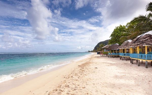Lalomanu is widely considered the most beautiful beach in Samoa, featuring white sands and a vibrant coral reef just off the shore. Following the 2009 tsunami, the community rebuilt the iconic beachfront "fales" (traditional open huts) where visitors can sleep under the stars. With its panoramic views of the uninhabited Aleipata islands, it is a tranquil paradise that showcases the resilient and hospitable spirit of the Samoan people.