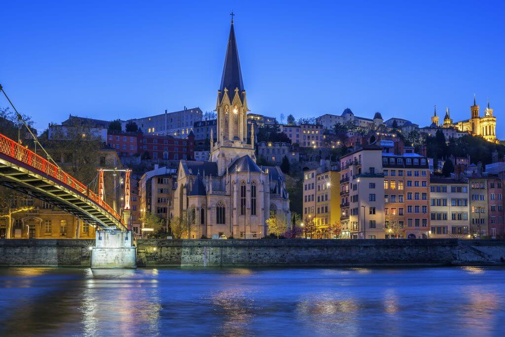 Famous-church-in-Lyon-with-Saone-river-atnight